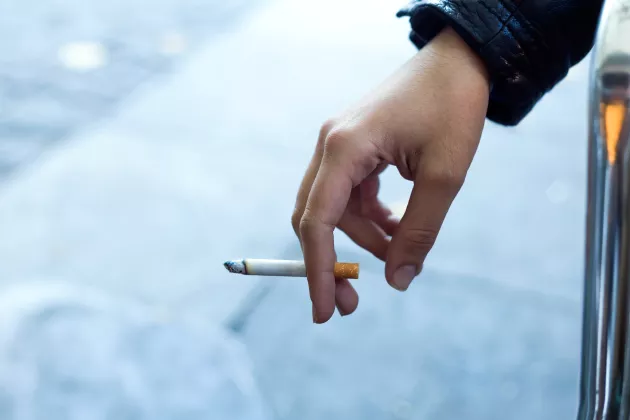Cigarette in hand